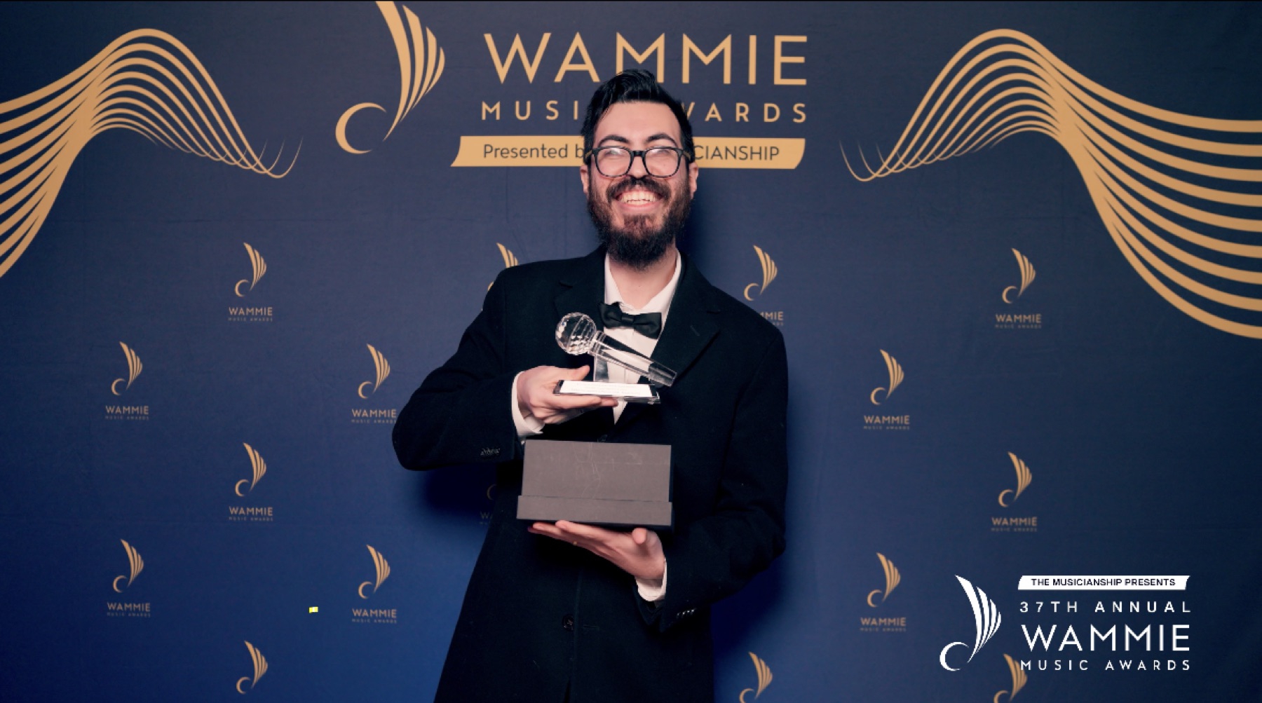 Felipe Paccagnella holding the Wammie trophy at the 37th Annual Wammie Music Awards